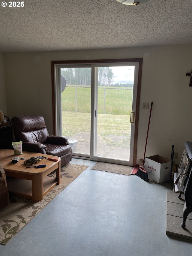 76984 Palmer Junction Rd, Elgin, OR 97827 - living room with finished concrete flooring and a textured ceiling