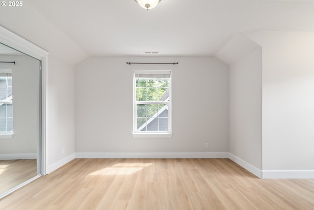 2795 Mallory Ln, Eugene, OR 97401 - additional living space with light wood-style flooring, vaulted ceiling, and baseboards