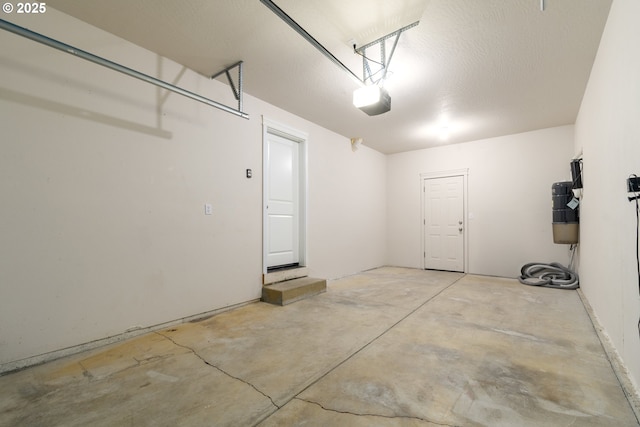 2795 Mallory Ln, Eugene, OR 97401 - garage featuring a garage door opener and a central vacuum unit