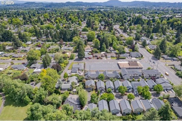 2795 Mallory Ln, Eugene, OR 97401 - aerial overview of property's location with a mountain backdrop and nearby suburban area