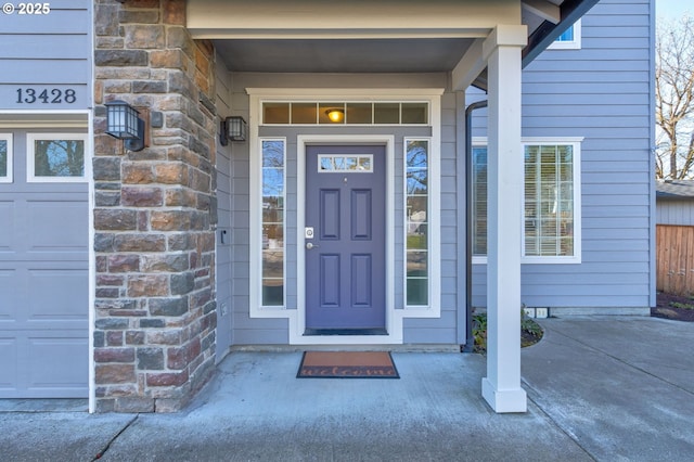 property entrance with stone siding