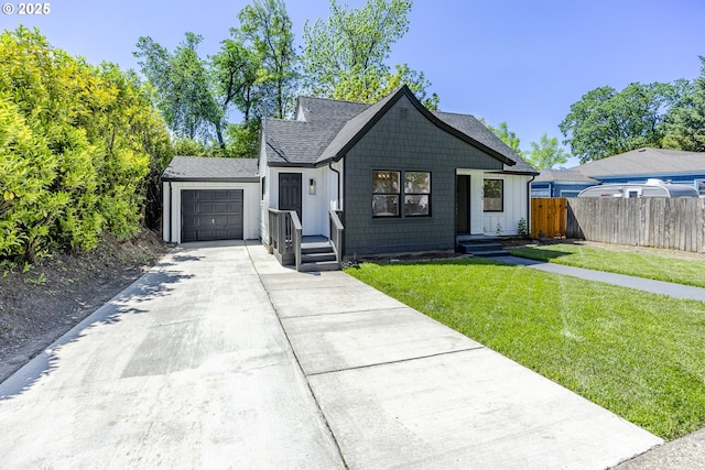 view of front facade with driveway, a garage, board and batten siding, and a shingled roof