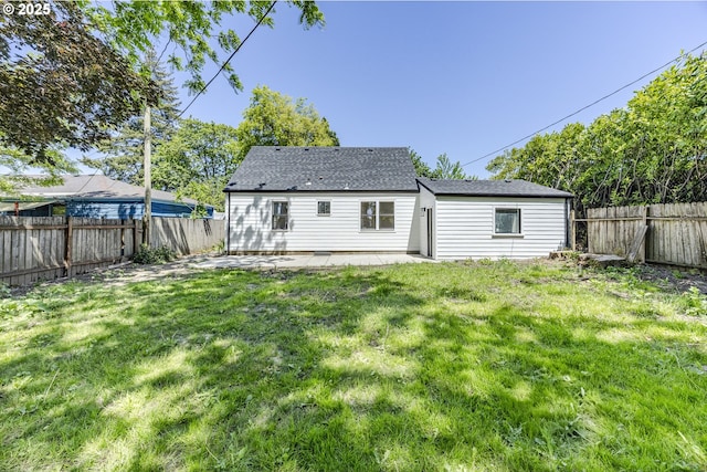 rear view of house with a patio and roof with shingles