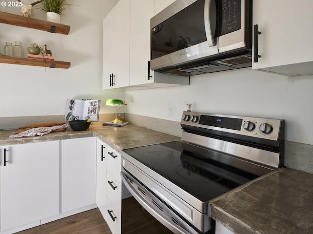 159 Bootjack Ln, Rose Valley, WA 98626 - kitchen with stainless steel appliances, white cabinets, and dark wood finished floors