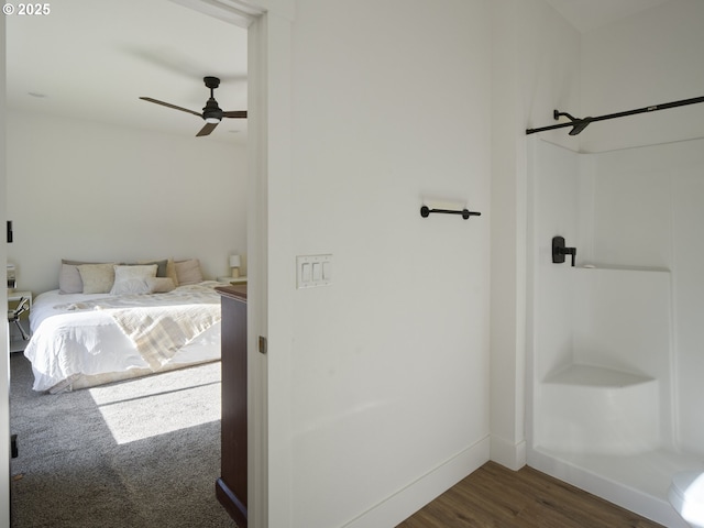 159 Bootjack Ln, Rose Valley, WA 98626 - full bathroom featuring wood finished floors, a ceiling fan, a shower, and baseboards