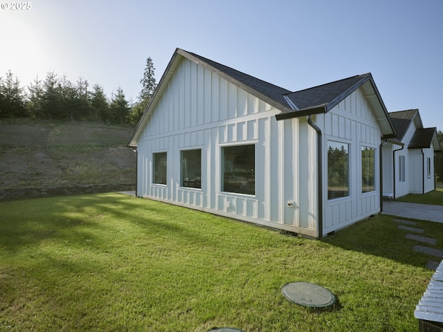 159 Bootjack Ln, Rose Valley, WA 98626 - back of house featuring board and batten siding, a yard, and a shingled roof