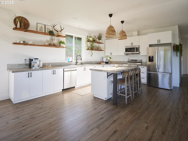 159 Bootjack Ln, Rose Valley, WA 98626 - kitchen featuring stainless steel appliances, open shelves, white cabinets, a sink, and dark wood-type flooring