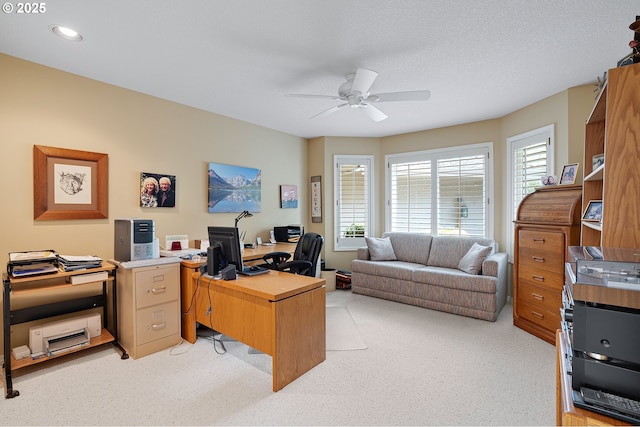 home office featuring ceiling fan and light colored carpet