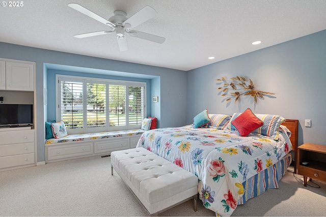 bedroom with light colored carpet, ceiling fan, and recessed lighting
