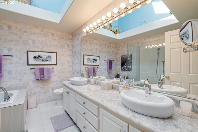 bathroom with tile patterned floors, a tile shower, double vanity, toilet, and a tub