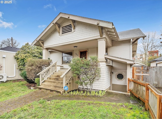 view of front of house with fence