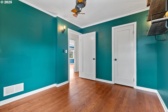 4621 NE 37th Ave, Portland, OR 97211 - unfurnished bedroom featuring wood finished floors, baseboards, crown molding, and a ceiling fan