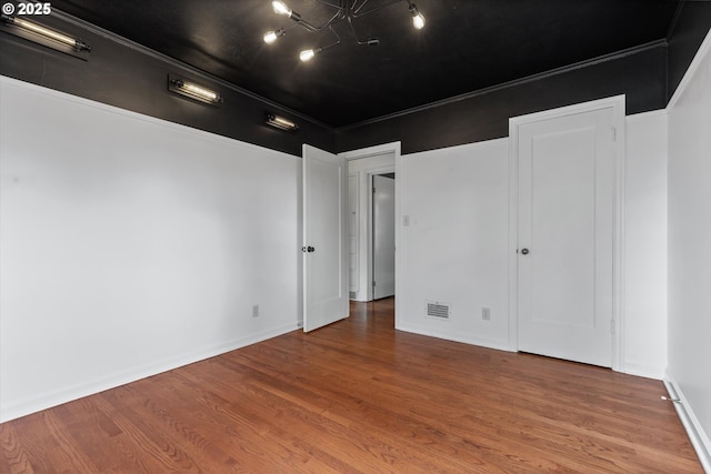 4621 NE 37th Ave, Portland, OR 97211 - unfurnished bedroom with wood finished floors and baseboards