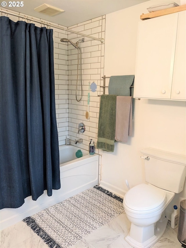 4621 NE 37th Ave, Portland, OR 97211 - full bath featuring shower / bath combo, toilet, marble look tiles, and baseboards