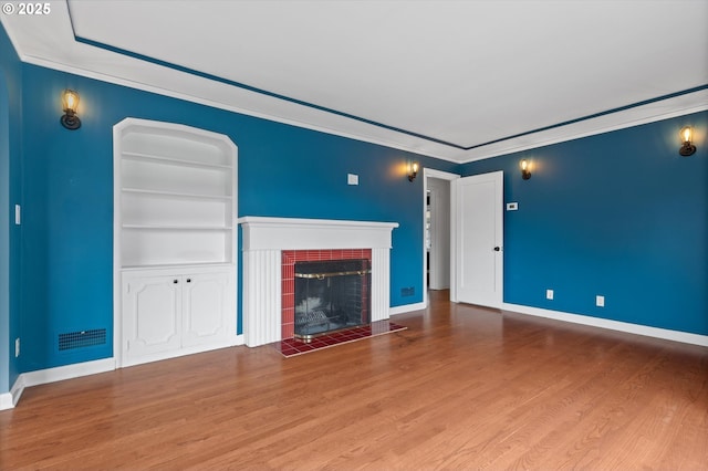 4621 NE 37th Ave, Portland, OR 97211 - unfurnished living room featuring wood finished floors, a brick fireplace, baseboards, and ornamental molding