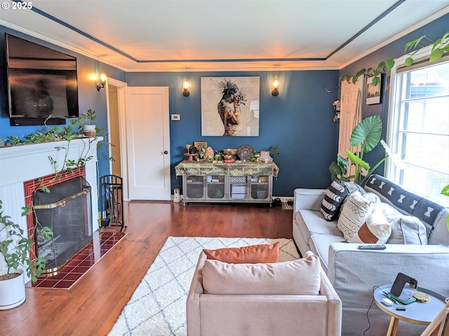 4621 NE 37th Ave, Portland, OR 97211 - living area featuring wood finished floors, a tiled fireplace, and crown molding