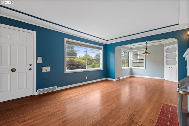 4621 NE 37th Ave, Portland, OR 97211 - unfurnished living room featuring wood finished floors, baseboards, and crown molding