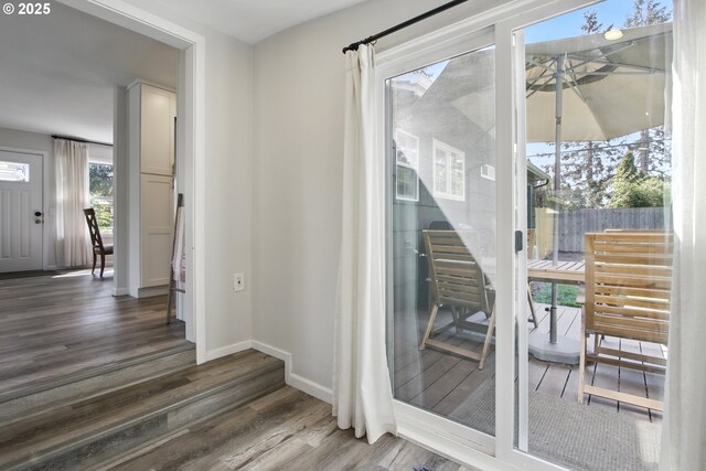 entryway featuring wood finished floors and baseboards