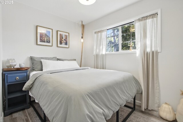 bedroom featuring wood finished floors