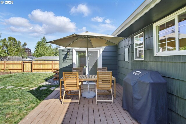 deck featuring area for grilling and outdoor dining space