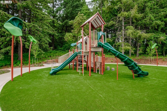 view of playground featuring a lawn