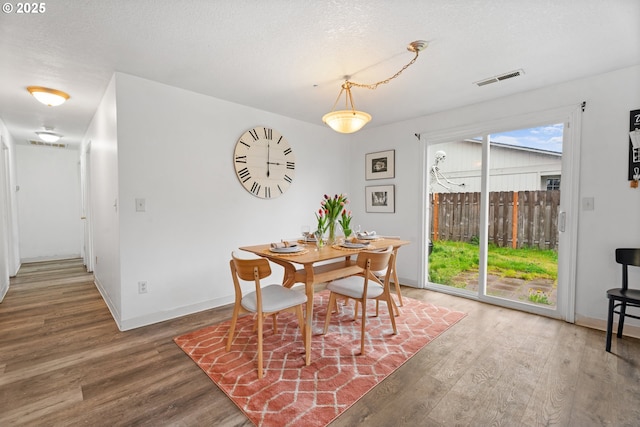 13816 NE 85th St, Vancouver, WA 98682 - dining space with wood finished floors, baseboards, and a textured ceiling