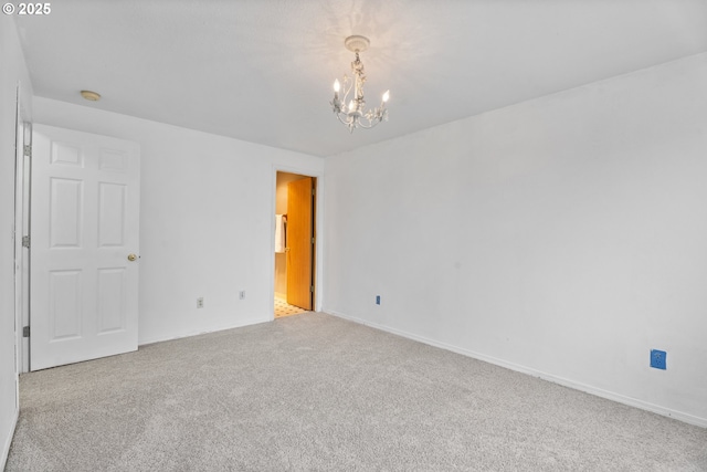 13816 NE 85th St, Vancouver, WA 98682 - empty room featuring a chandelier, carpet floors, a smoke detector, and baseboards