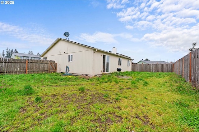 13816 NE 85th St, Vancouver, WA 98682 - rear view of house with a chimney and a fenced backyard