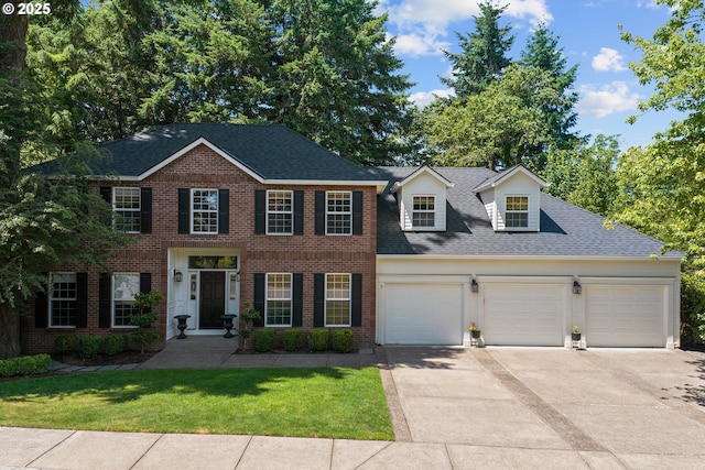 12723 Adrian Ct, Lake Oswego, OR 97034 - view of front facade featuring a garage, driveway, brick siding, and a shingled roof