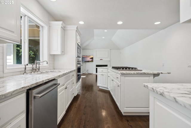 12723 Adrian Ct, Lake Oswego, OR 97034 - kitchen with appliances with stainless steel finishes, dark wood-type flooring, white cabinetry, vaulted ceiling, and recessed lighting