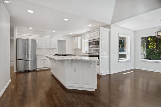 12723 Adrian Ct, Lake Oswego, OR 97034 - kitchen featuring appliances with stainless steel finishes, white cabinetry, dark wood finished floors, and recessed lighting
