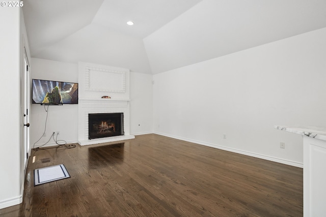 12723 Adrian Ct, Lake Oswego, OR 97034 - unfurnished living room featuring vaulted ceiling, dark wood-type flooring, a brick fireplace, and recessed lighting