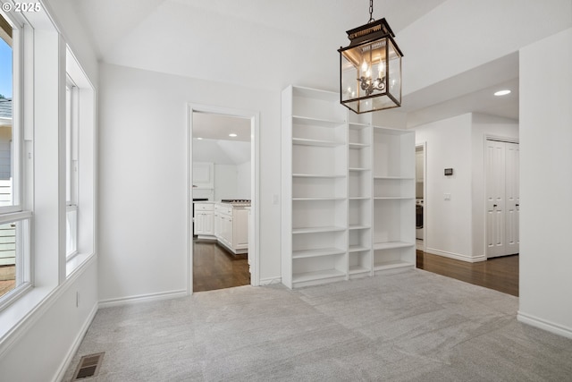 12723 Adrian Ct, Lake Oswego, OR 97034 - unfurnished dining area with dark colored carpet, a chandelier, and recessed lighting