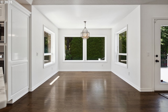 12723 Adrian Ct, Lake Oswego, OR 97034 - unfurnished dining area featuring dark wood-style flooring and a chandelier