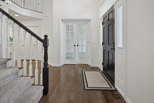 12723 Adrian Ct, Lake Oswego, OR 97034 - entryway featuring stairs, dark wood-style floors, a high ceiling, and french doors