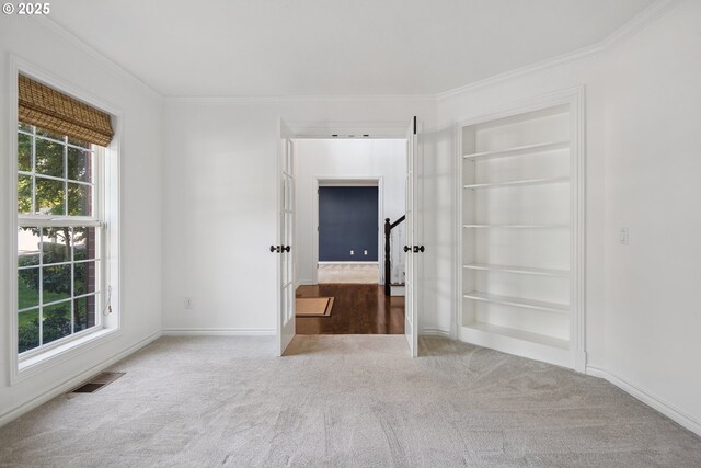 12723 Adrian Ct, Lake Oswego, OR 97034 - carpeted spare room featuring built in features and crown molding