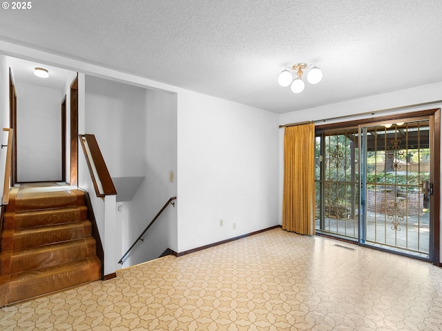 15416 NE Holladay St, Portland, OR 97230 - unfurnished room featuring a textured ceiling, baseboards, and visible vents