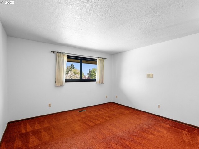 15416 NE Holladay St, Portland, OR 97230 - carpeted empty room with a textured ceiling, visible vents, and baseboards