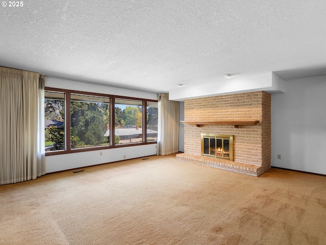 15416 NE Holladay St, Portland, OR 97230 - unfurnished living room with a textured ceiling, visible vents, a fireplace, baseboards, and carpet flooring