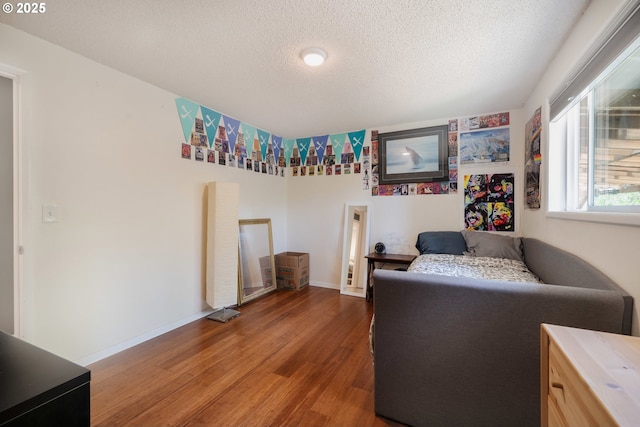 1378 SW Taylors Ferry Ct, Portland, OR 97219 - bedroom featuring wood finished floors and a textured ceiling