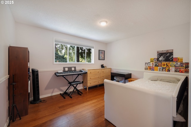 1378 SW Taylors Ferry Ct, Portland, OR 97219 - bedroom with wood-type flooring and a textured ceiling