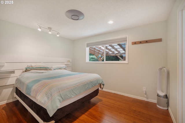 1378 SW Taylors Ferry Ct, Portland, OR 97219 - bedroom with wood finished floors, a textured ceiling, and recessed lighting