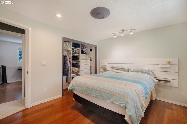 1378 SW Taylors Ferry Ct, Portland, OR 97219 - bedroom featuring wood finished floors, recessed lighting, a closet, and a textured ceiling