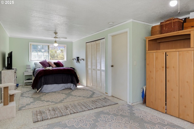 bedroom featuring a textured ceiling, ceiling fan, baseboards, and crown molding