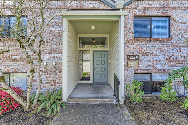 entrance to property with brick siding