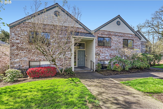 view of front of home with brick siding