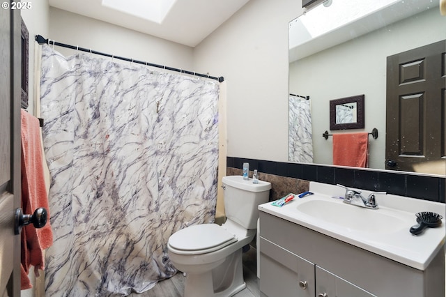 169 W 2nd St, Lafayette, OR 97127 - bathroom featuring tile walls, vanity, a skylight, and a shower with shower curtain