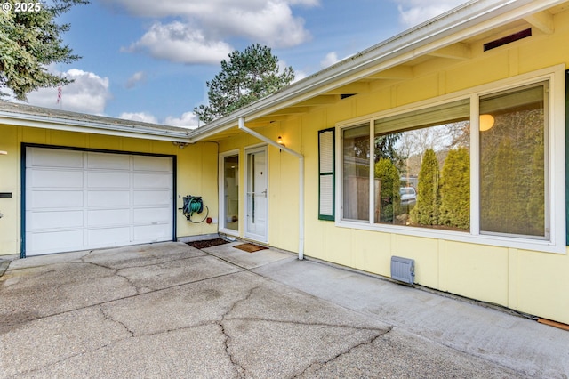 entrance to property featuring a garage