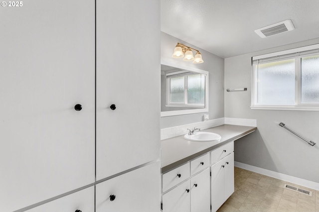 bathroom featuring vanity and a healthy amount of sunlight