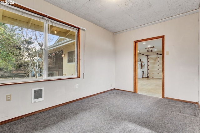 carpeted empty room featuring electric water heater